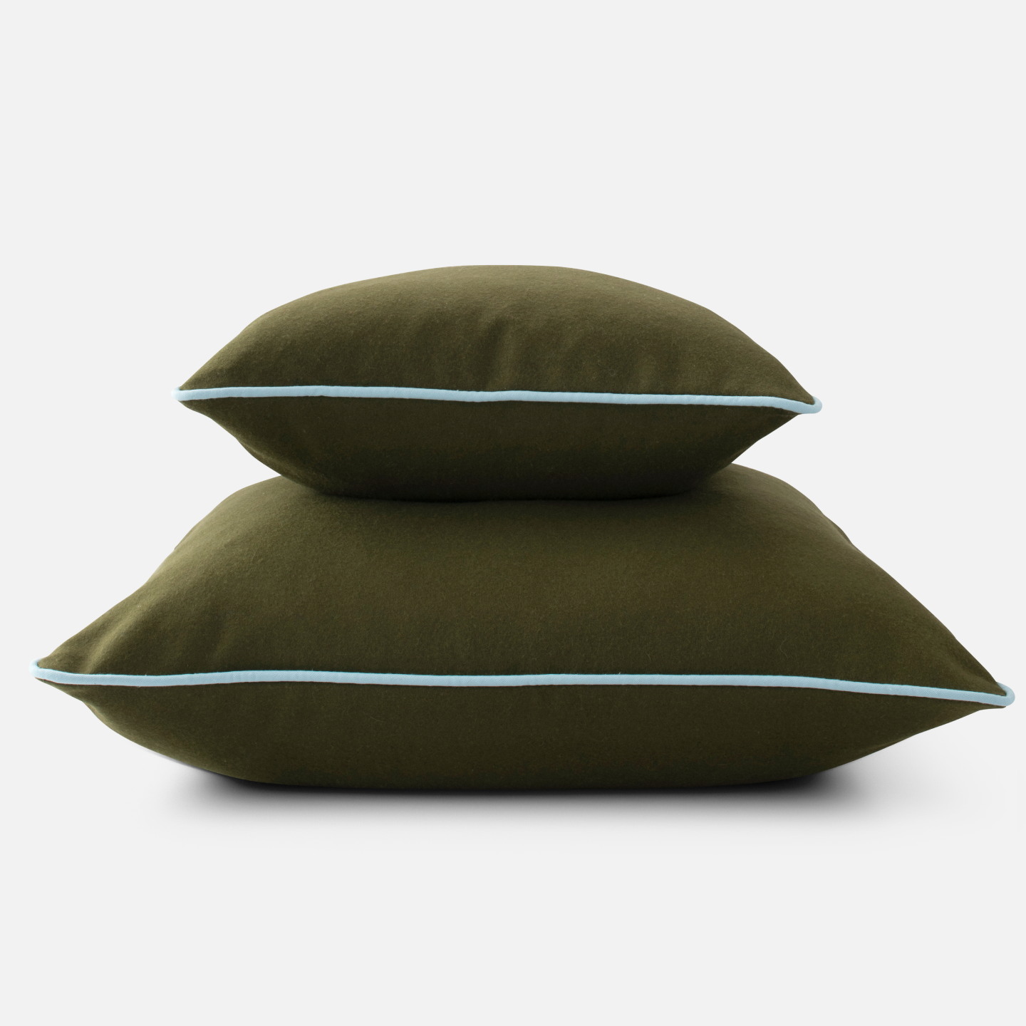 large and small forest green with light blue piping throw pillows